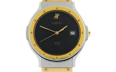 HUBLOT - an MDM wrist watch. Stainless steel case with yellow metal bezel. Case width 36mm.