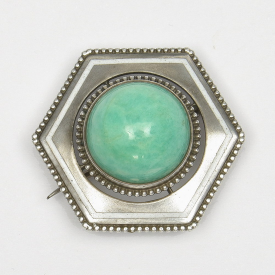 Hexagonal silver brooch with green stone and white enamel ring,...