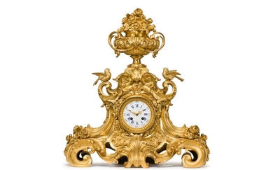 IMPORTANT HANGER in chased, gilt and openwork bronze decorated with shells, birds, acanthus leaves, flowers and horns of plenty. It is topped by a Medici vase in bloom. The enamelled dial with Roman numerals and Arabic numerals signed F. GAUTIER;...