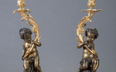 Important pair of Louis XV style candlesticks in gilded and blued bronze following models of Clodion. Shafts with small Bacchus. Bases and candlesticks with rockeries. Height: 53 cm. Exit: 1.400uros. (232.940 Ptas.)