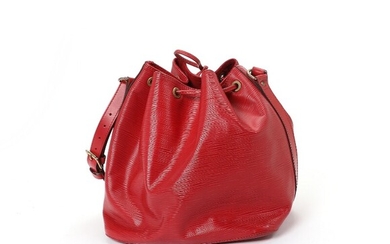 NOT SOLD. Louis Vuitton: A "Noe" bag made of red epi leather with gold toned...