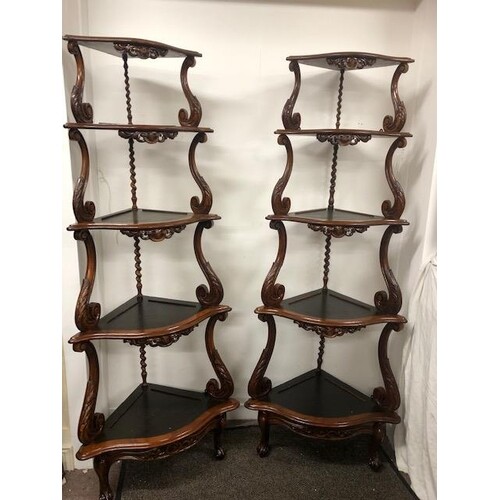 Pair of 19th C. walnut five tiered corner whatnots on acanth...