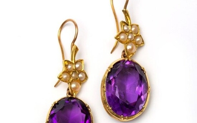 Pair of gold earrings, each with an oval...