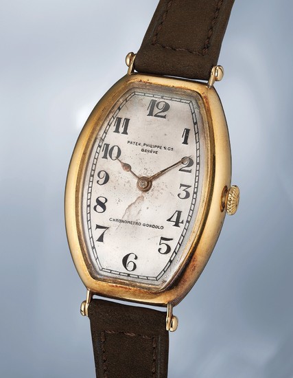 Patek Philippe, An extremely rare yellow gold tonneau shaped wristwatch with box