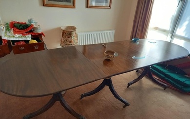 Regency style mahogany dining table on triple pod supports. ...