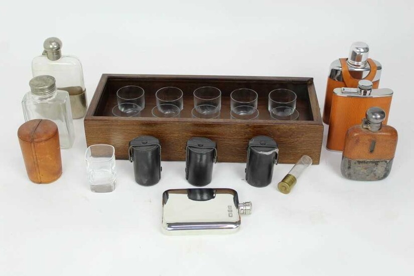 Set of ten etched glass peg marker shot glasses, numbered 1 to 10, in fitted wooden case, together with five hip flaks and assorted field glasses in cases