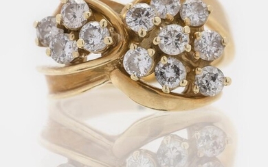 14KT GOLD AND DIAMOND CLUSTER RING Set with...