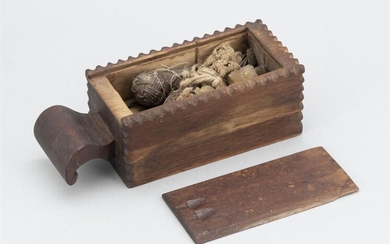 CHIP-CARVED NEEDLE CASE 19th Century Rectangular walnut box...