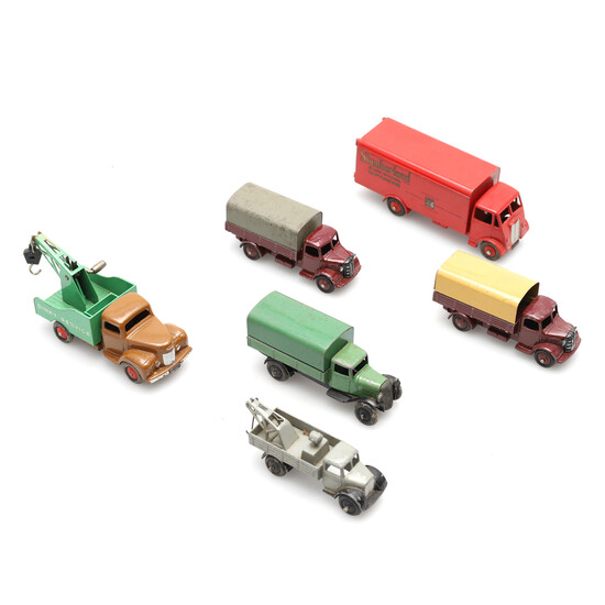 THREE DINKY COVERED WAGONS AND OTHER FREIGHT VEHICLES.
