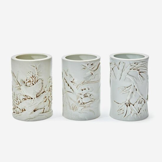 Three Chinese molded and carved porcelain brushpots