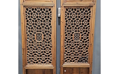 Two Chinese late 19th/early 20th century pierced wooden pane...