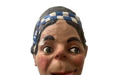 Two big heads: Woman with the headband and Woman with the hat, made of polychrome papier-mâché. Spain. 1960. Height. 57 and 69 cm