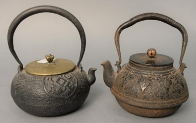Two early Japanese iron and bronze teapots, one with