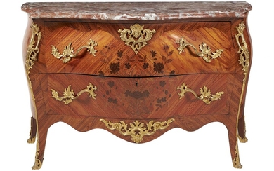 Y A kingwood, tulipwood inlaid, and gilt metal mounted commode in Louis XV style