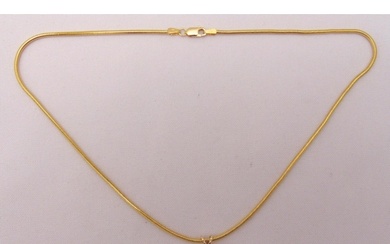 Yellow gold and diamond pendant on a 14ct yellow gold chain,...