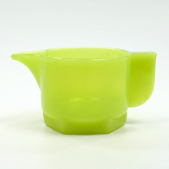 Yellow pressed milk jug (saucer is missing), design...