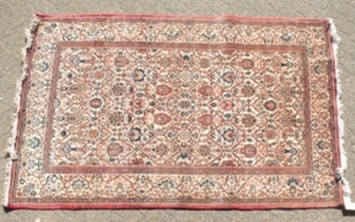 A LARGE PERSIAN KASHAN RUG with allover design on a