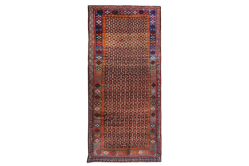 AN ANTIQUE KURDISH LONG RUG approx: 9ft.7in. x 4ft.7in.((291cm....