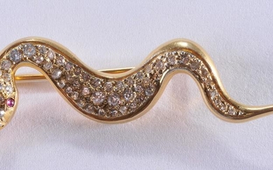 14k yellow gold, diamond, and ruby snake brooch.