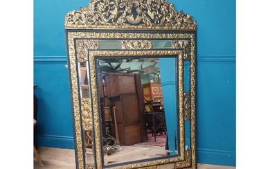 19th C. French brass and ebonised cushion mirror surmounted...