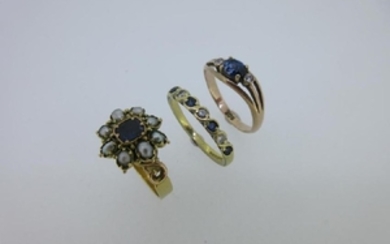 A collection of three sapphire and gemstone rings set
