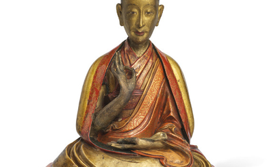 A GILT-LACQUERED STUCCO FIGURE OF A LAMA, TIBET, 18TH-19TH CENTURY