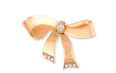 A GOLD AND DIAMOND BROOCHThe yellow gold bow, cent…