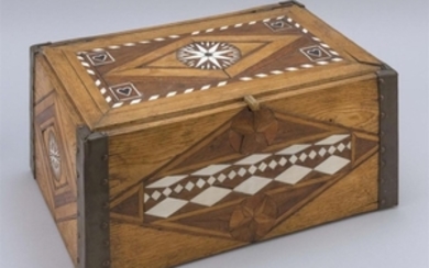 INLAID AND COPPER-BOUND OAK LIFT-TOP BOX Whale ivory and alternating wood inlay creates a compass rose, heart and banded design on t...