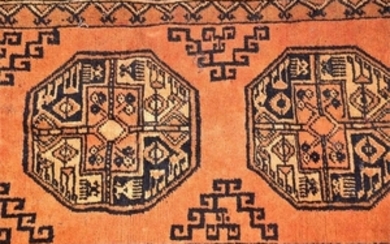 A red ground Afghan wool carpet and one other the fringed Afghan example decorated with geometric medallions in concentric...