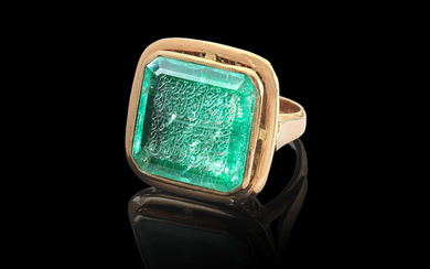 An engraved calligraphic emerald
