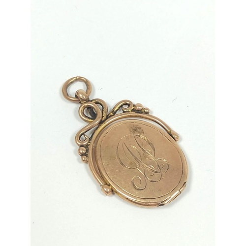 9ct gold swivel locket, initialled 1920. 6g