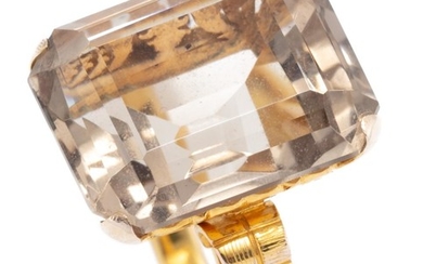 A 14CT GOLD QUARTZ COCKTAIL RING; featuring a step cut smoky quartz of approx. 16.3ct to pierced scrolling gallery and engraved shou...