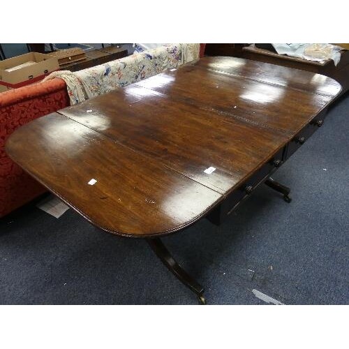 A 19th century mahogany Sofa Table, the rectangular twin-fla...