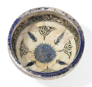 A BLUE AND BLACK KASHAN CONICAL BOWL, CENTRAL IRAN, 12TH CENTURY