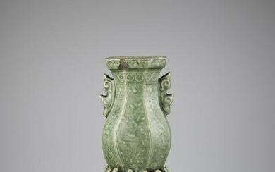 A CARVED LONGQUAN WALL VASE, MING
