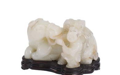 A CARVED WHITE JADE HORSE WITH BOY