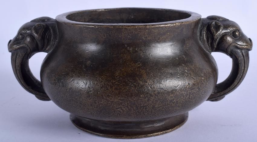A CHINESE TWIN HANDLED BRONZE CENSER BEARING XUANDE