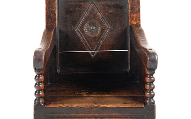 A Charles II Oak Armchair