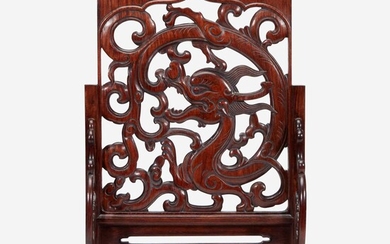 A Chinese carved and pierced huanghuali "dragon" panel, in later hardwood stand 黄花梨镂雕龙纹木板 后配底座 The panel late Ming/Qing dynasty 木板为明或清