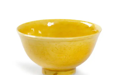 A Chinese monochrome yellow 'dragon' wine cup Republic period Incised to the...