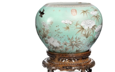 A Chinese porcelain globe jar. Mark of Yong Qing Chang Chun. On a richly carved wooden stand. H. 28 cm. Dia. 40 cm. Wooden base 17 cm.