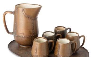 A Clewell copper-clad ceramic cider set