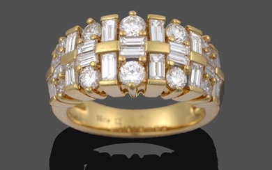 A Diamond Ring, pairs of graduated baguette cut diamonds running...