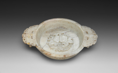 A FINELY CARVED 'CHICKEN BONE' JADE 'MARRIAGE' BOWL