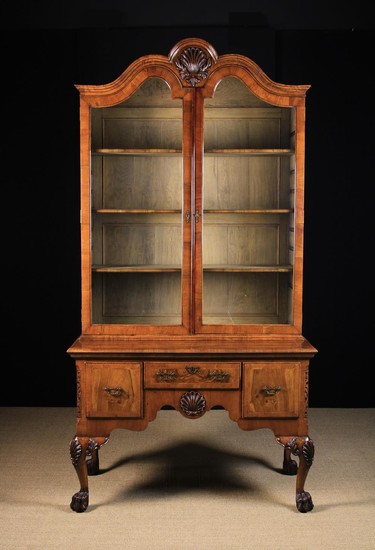 A Fine Quality 19th Century Irish Walnut Veneered Cabinet on Stand. The glazed upper section surmoun
