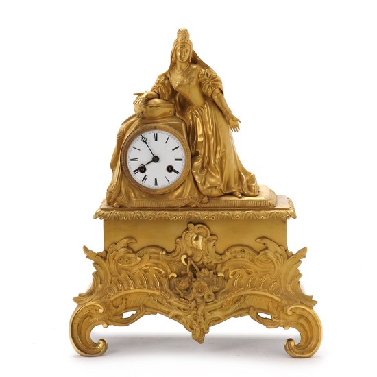 A French Louis Philippe gilt bronze figural mantel clock. Second half of the 19th century. H. 43 cm. W. 34 cm. D. 14 cm.