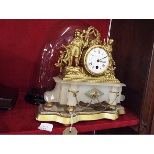 A French gilt and ormolu time-piece the drum barrel clock ha...