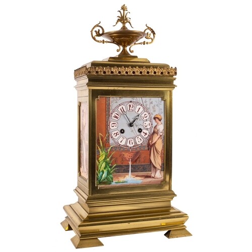 A French gilt-brass and porcelain panelled mantel clock: the...