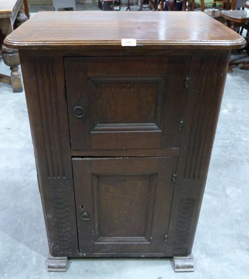 A French joined oak cupboard in gothic style, with fielded s...