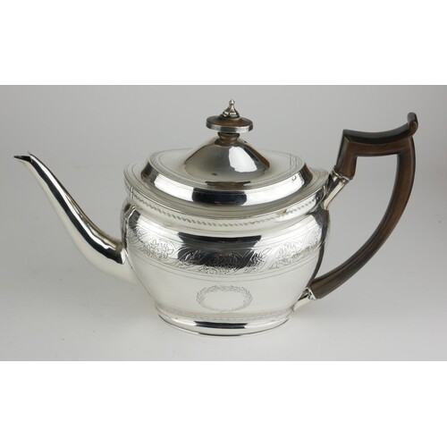 A GEORGE III CLASSICAL FORM SILVER OVAL TEAPOT With carved ...